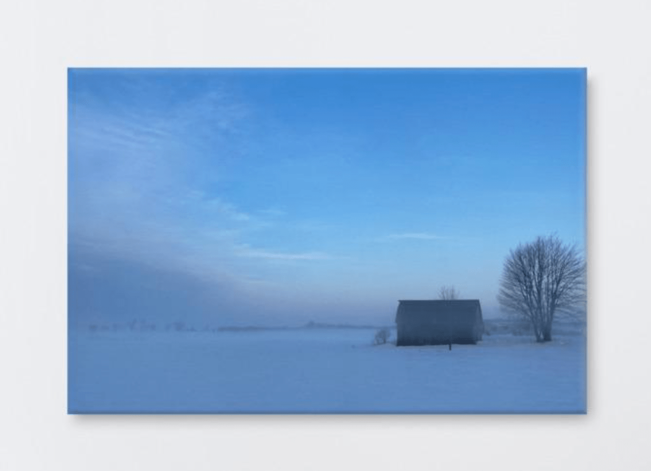 Old barn in snow field - the wheaten store